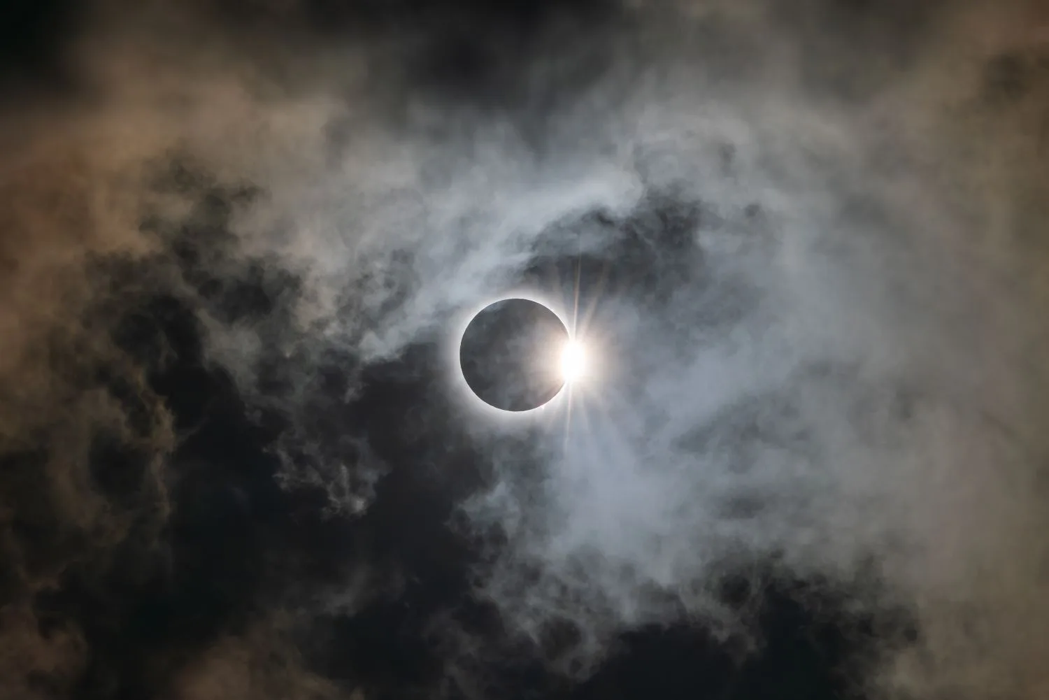 A partial solar eclipse seen through clouds, illustrating London’s 12 August 2026 eclipse