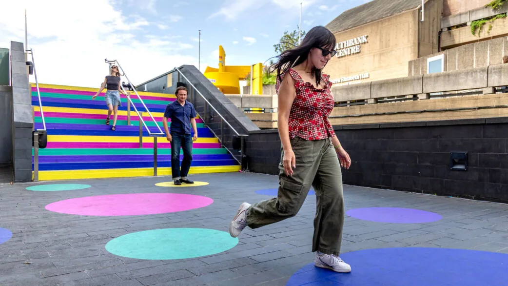 Visitors playing Luke Jerram’s colourful musical staircase installation at the Southbank Centre