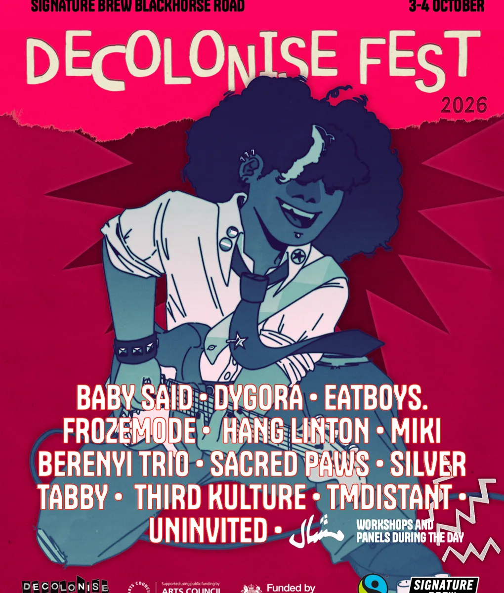 Bright red and blue Decolonise Fest poster showing a punk guitarist and the 3–4 October dates